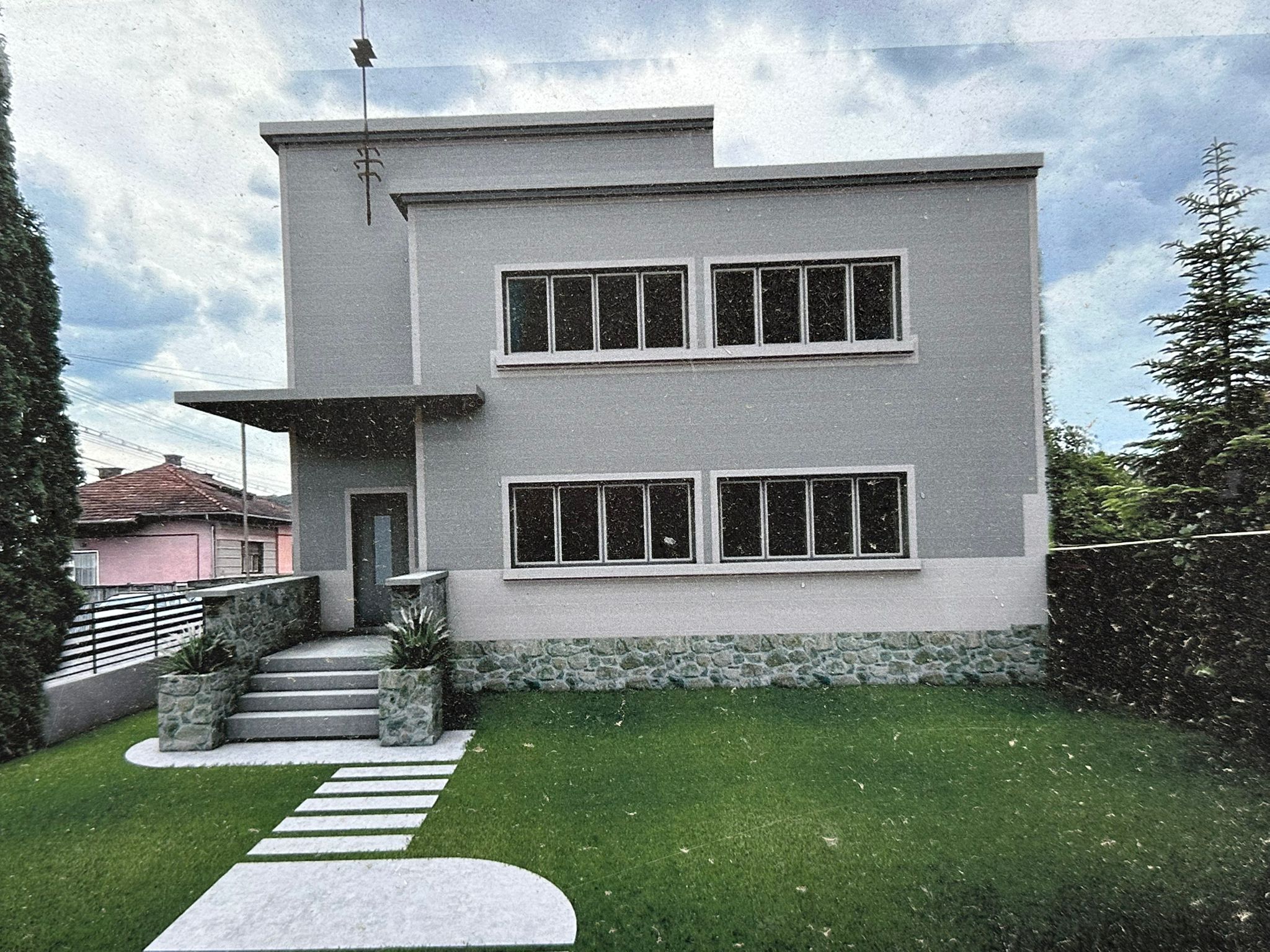 Lapos tető a piros cserepek között